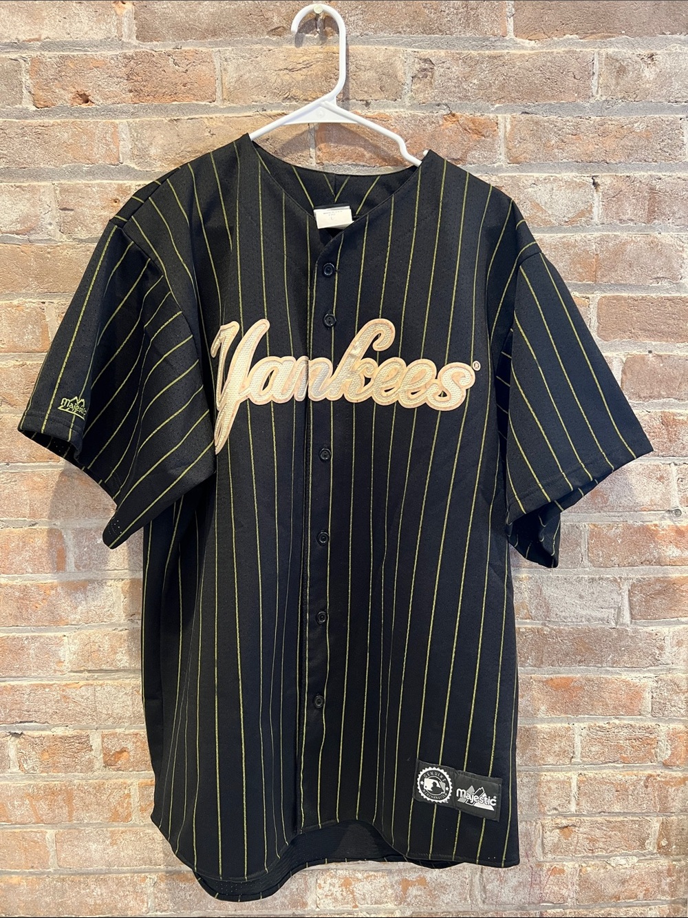 New York Yankees Black Pinstripe Button-Up Jersey with Gold Script